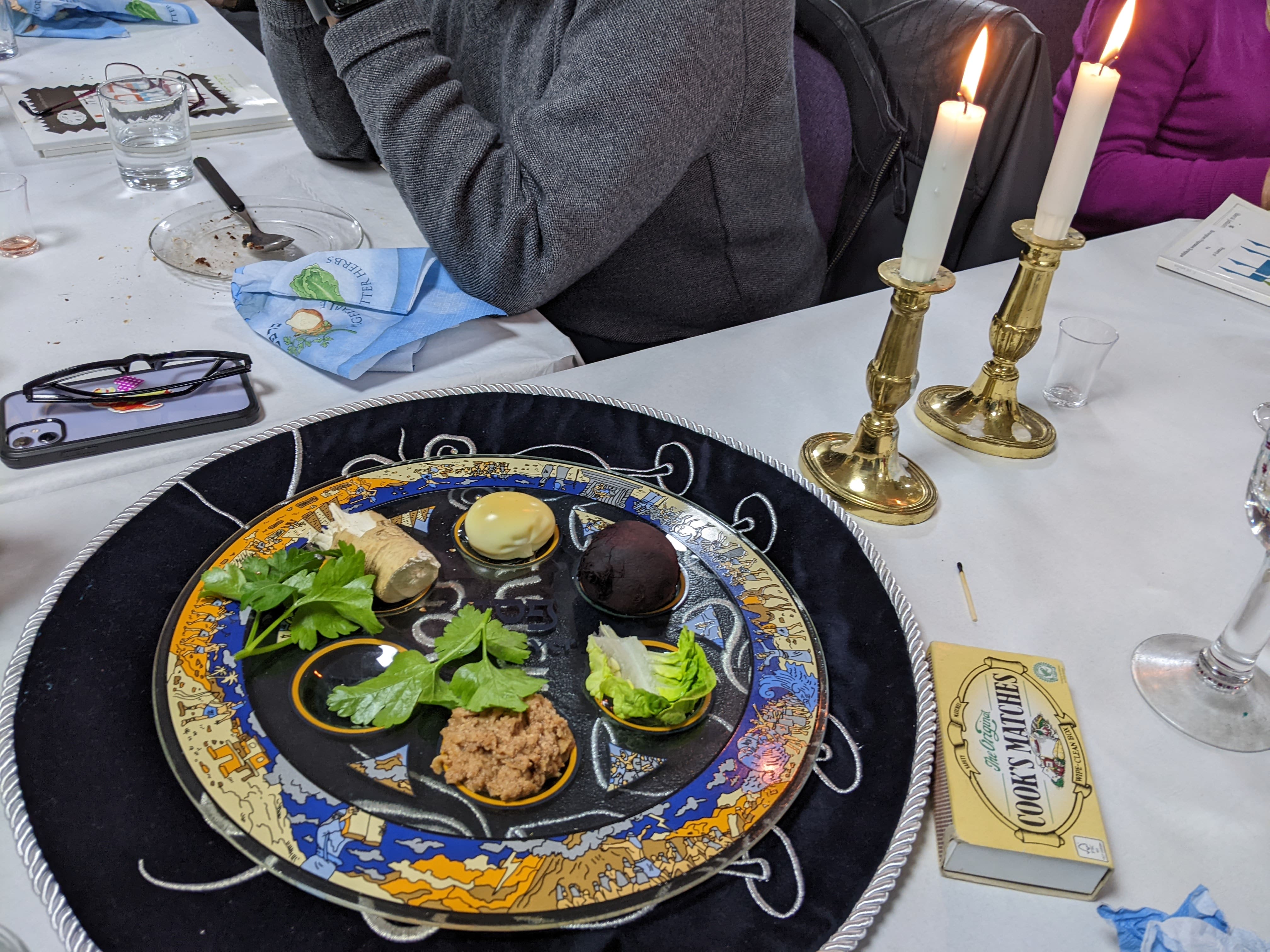 Candles beside the traditional seder plate...